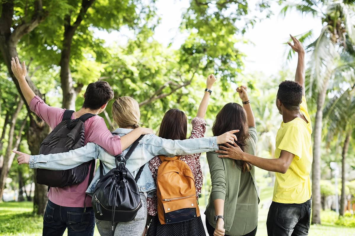 young people walking together in nature